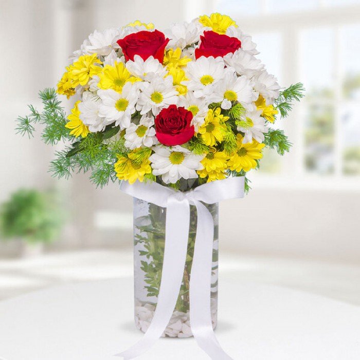 Mixed Flowers in Tall Glass Vase